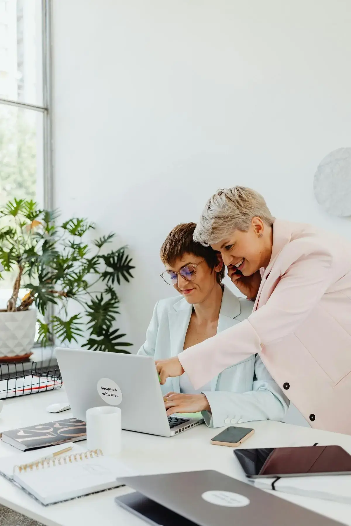 Two female entrepreneurs working on their business together